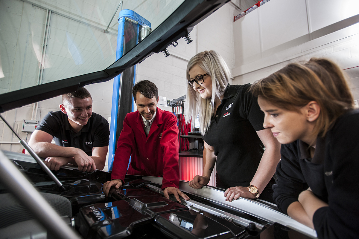 Audi apprentices with car